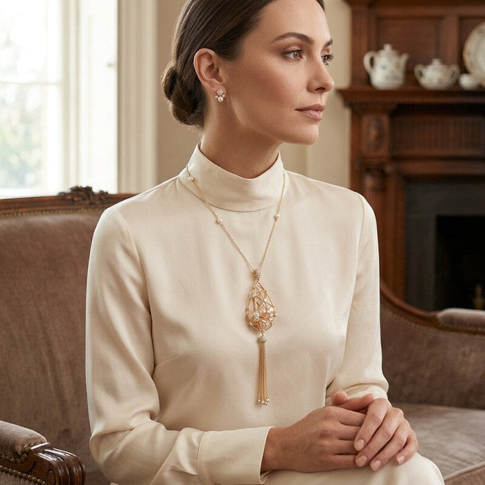 Carolee Pear Shaped Caged Pendant Tassel Necklace by Vanessa Jane