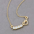 0.24 Ct Round Blue Aquamarine Prong 18K Gold Plated Silver Heart & Infinity Necklace by Fine Color Jewels