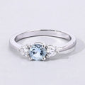 0.38 Ct Round Blue Aquamarine and Lab Diamond Prong Silver Three Stone Ring by Fine Color Jewels