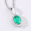 0.44 Ct oval green Zambian Emerald and Lab Diamond prong Silver Halo pendant Necklace by Fine Color Jewels