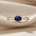 0.53 Ct Oval Blue Sapphire and White Sapphire Prong 22k Gold Vermeil Three Stone Promise Ring by Fine Color Jewels