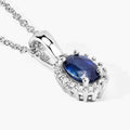 0.55 Ct oval Blue Sapphire and Lab Diamond prong Silver Halo pendant Necklace by Fine Color Jewels