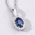 0.55 Ct oval Blue Sapphire and Lab Diamond prong Silver Halo pendant Necklace by Fine Color Jewels