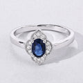 0.55 Ct Oval Blue Sapphire and Lab Diamond Silver Prong Floral Halo Ring by Fine Color Jewels