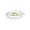 0.56 Ct Oval Green Peridot Channel Silver Three Stone Bypass Ring