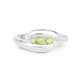 0.56 Ct Oval Green Peridot Channel Silver Three Stone Bypass Ring by Fine Color Jewels