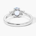 0.60 Ct Oval Blue Aquamarine and Lab Diamond Prong Silver Three Stone Ring by Fine Color Jewels
