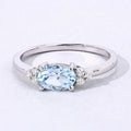 0.60 Ct Oval Blue Aquamarine and Lab Diamond Prong Sterling Silver Cocktail Ring by Fine Color Jewels