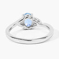 0.60 Ct Oval Blue Aquamarine and Lab Diamond Prong Sterling Silver Bypass Ring by Fine Color Jewels