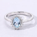 0.60 Ct Oval Blue Aquamarine and Lab Diamond Prong Sterling Silver Halo Ring by Fine Color Jewels