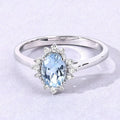 0.60 Ct Oval Blue Aquamarine and Lab Diamond Silver Halo Statement Ring by Fine Color Jewels