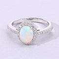 0.65 Ct Oval White Ethiopian Opal and Lab Diamond Prong Silver Halo Pave Ring by Fine Color Jewels