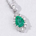 0.65 Ct Pear Green Zambian Emerald & Lab Diamond Prong Silver Teardrop Halo Pendant Necklace by Fine Color Jewels
