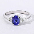 0.75 Ct Oval Violet Tanzanite and Lab Diamond Prong Silver Cocktail Ring by Fine Color Jewels
