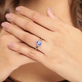 0.75 Ct Oval Violet Tanzanite and Lab Diamond Prong Silver Halo Statement Ring by Fine Color Jewels