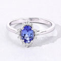 0.75 Ct Oval Violet Tanzanite and Lab Diamond Prong Silver Halo Statement Ring by Fine Color Jewels
