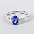 0.75 Ct Oval Violet Tanzanite and Lab Diamond Prong Silver Pave Band Ring by Fine Color Jewels