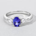 0.75 Ct Oval Violet Tanzanite and Lab Diamond Prong Silver Three Stone Ring by Fine Color Jewels