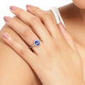 0.75 Ct Oval Violet Tanzanite and Lab Grown Diamond Prong Silver Halo Ring by Fine Color Jewels