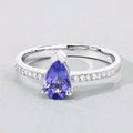 0.78 Ct Pear Violet Tanzanite and Lab Diamond V-Prong Silver Pave Bridge Ring by Fine Color Jewels