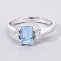 0.80 Ct Octagon Blue Aquamarine and Lab Diamond Prong Silver Three Stone Ring by Fine Color Jewels