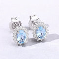 0.80 Ct Oval Blue Aquamarine & Lab Diamond Prong Silver Halo Basket Stud Earrings by Fine Color Jewels