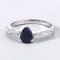 0.80 Ct Pear Blue Sapphire and Lab Diamond Prong Silver Pave Crossover Ring by Fine Color Jewels