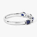 0.80 Ct Pear Blue Sapphire and Lab Diamond Prong Silver Seven Stone Half Eternity Ring by Fine Color Jewels