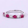 0.80 Ct Pear Pink Mozambique Ruby & Lab Diamond Silver Prong Seven Stone Half Eternity Ring by Fine Color Jewels