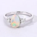 0.90 Ct Pear White Ethiopian Opal and Lab Diamond Prong Silver Three Stone Ring by Fine Color Jewels