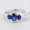 0.99 Ct Oval Blue Sapphire and Lab Diamond Prong Silver Three Stone Cocktail Ring by Fine Color Jewels