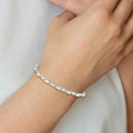 Oval White Created Opal & Diamond Prong Sterling Silver Infinity Link Bracelet by Fine Color Jewels