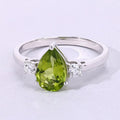 1.10 Ct Pear Green Peridot and Lab Diamond Prong Silver Three Stone Ring by Fine Color Jewels