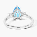 1.30 Ct Pear Swiss Blue Topaz and Lab Diamond Prong Silver Three Stone Ring by Fine Color Jewels