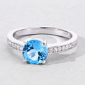 1.48 Ct Round Swiss Blue Topaz & Lab Diamond Prong Silver Pave Bridge Ring by Fine Color Jewels