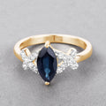 1.50ct Marquise Blue Sapphire and White Diamond Prong 14K Yellow Gold Criss-Cross Ring by Fine Color Jewels