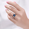 1.60 Ct Octagon London Blue Topaz and Lab Diamond Prong Silver Pave Bridge Ring by Fine Color Jewels