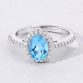 1.60 Ct Oval Swiss Blue Topaz and Lab Diamond Prong Silver Halo Pave Ring by Fine Color Jewels