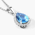 1.90 Ct pear Swiss Blue Topaz and Lab Diamond prong Silver Halo teardrop pendant Necklace by Fine Color Jewels