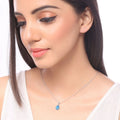 1.90 Ct pear Swiss Blue Topaz and Lab Diamond prong Silver Halo teardrop pendant Necklace by Fine Color Jewels