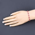Marquise Pink Ruby Prong 10K Yellow Gold Tennis Bracelet by Fine Color Jewels