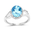 10K White Gold Blue Topaz Halo Ring with White Diamonds by Fine Color Jewels