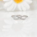 Round White Lab Diamond Pave Silver Infinity Criss Cross Ring by Fine Color Jewels
