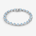 Heart Blue Topaz Prong Silver Tennis Bracelet by Fine Color Jewels