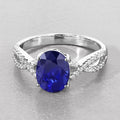 2.18 Ct Oval Ceylon Blue Sapphire and White Diamond Prong 18K White Gold Pave Crossover Engagement Ring by Fine Color Jewels