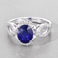 2.33 Ct Oval Ceylon Blue Sapphire and White Diamond Prong 18K White Gold Pave Halo Crossover Ring by Fine Color Jewels