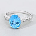 2.55 Ct Oval Swiss Blue Topaz and Lab Diamond Prong Silver Bridge Ring by Fine Color Jewels