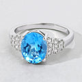 2.55 Ct Oval Swiss Blue Topaz & Lab Diamond Prong Silver Bridge Ring by Fine Color Jewels