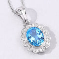 2.55 Ct Oval Swiss Blue Topaz & Lab Diamond Prong Silver Halo Floral Pendant Necklace by Fine Color Jewels