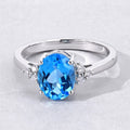 2 Ct Oval Swiss Blue Topaz and Lab Diamond Prong Silver Cocktail Ring by Fine Color Jewels
